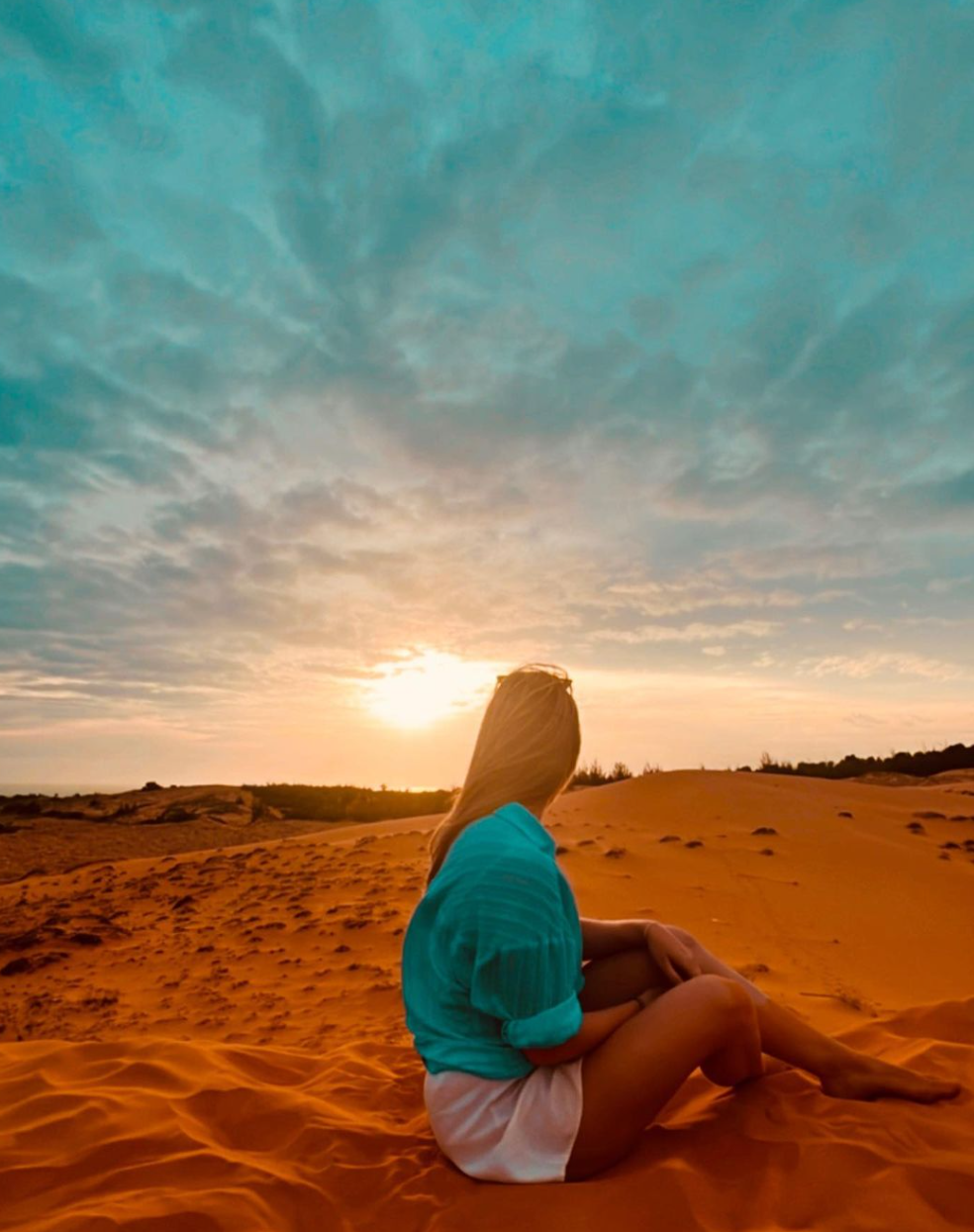 Sunset on red sand dunes